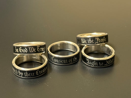 Collection of handmade embedded text silver bands with USA Patriot Theme