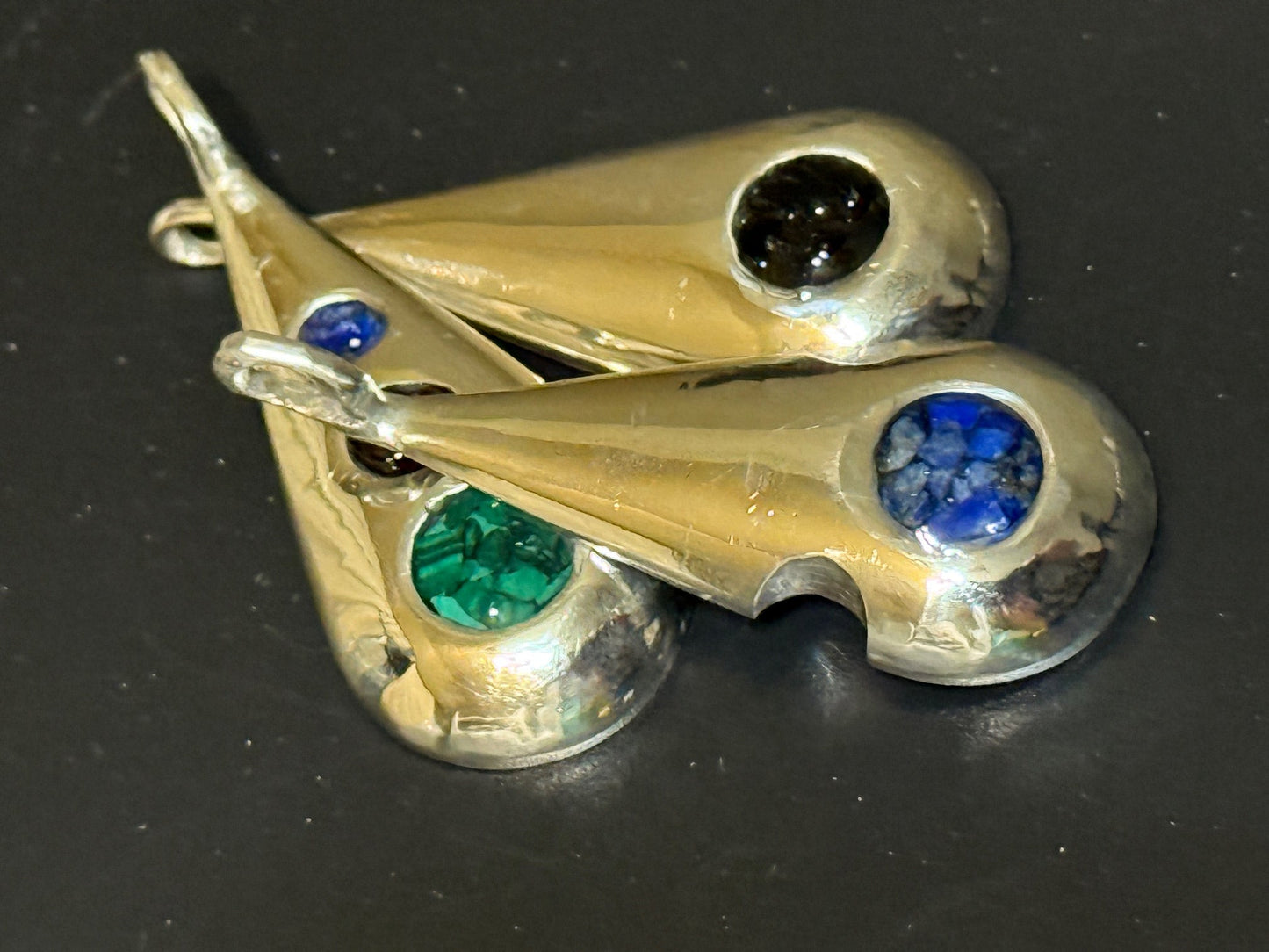 Collection of handmade silver pendants with one, two or three natural stone chips.
