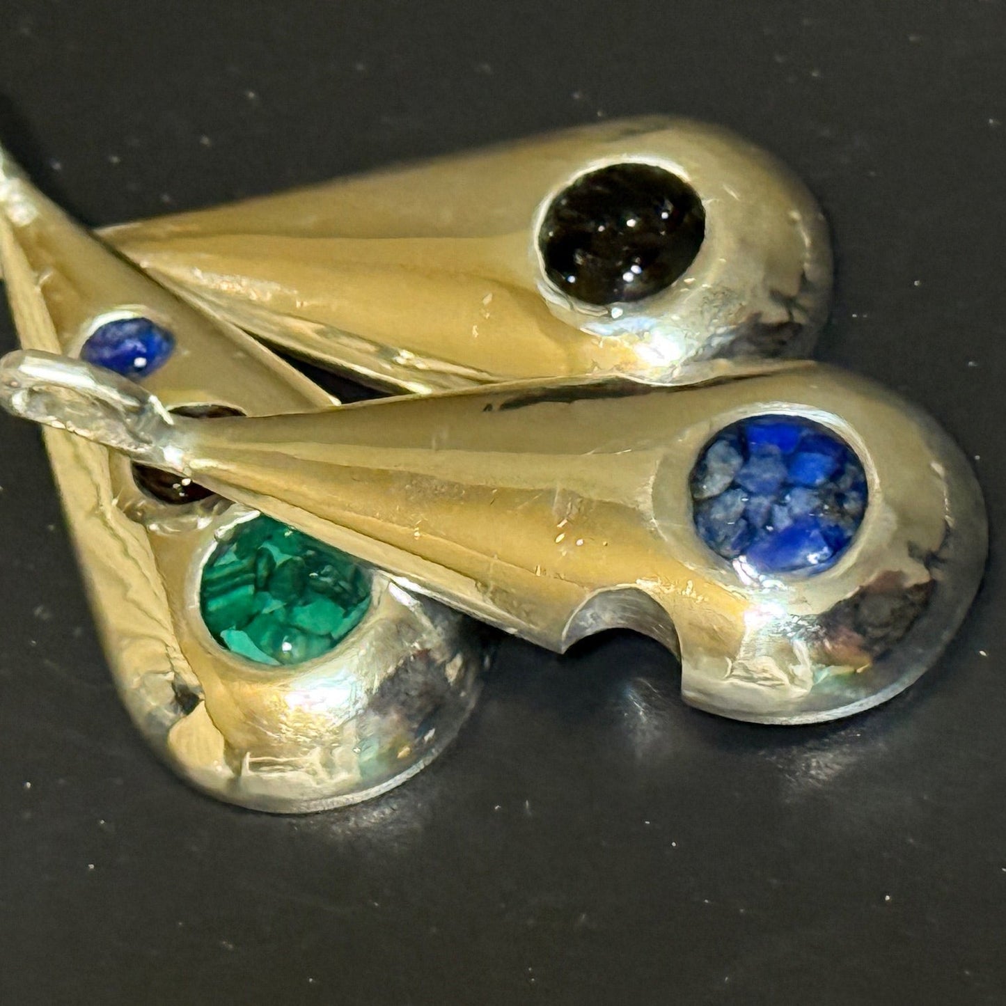 Collection of handmade silver pendants with one, two or three natural stone chips.