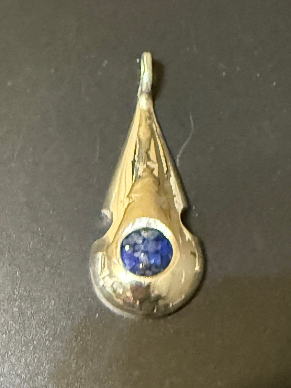 Handmade silver pendant with lapis natural stone chips and scalloped edge.
