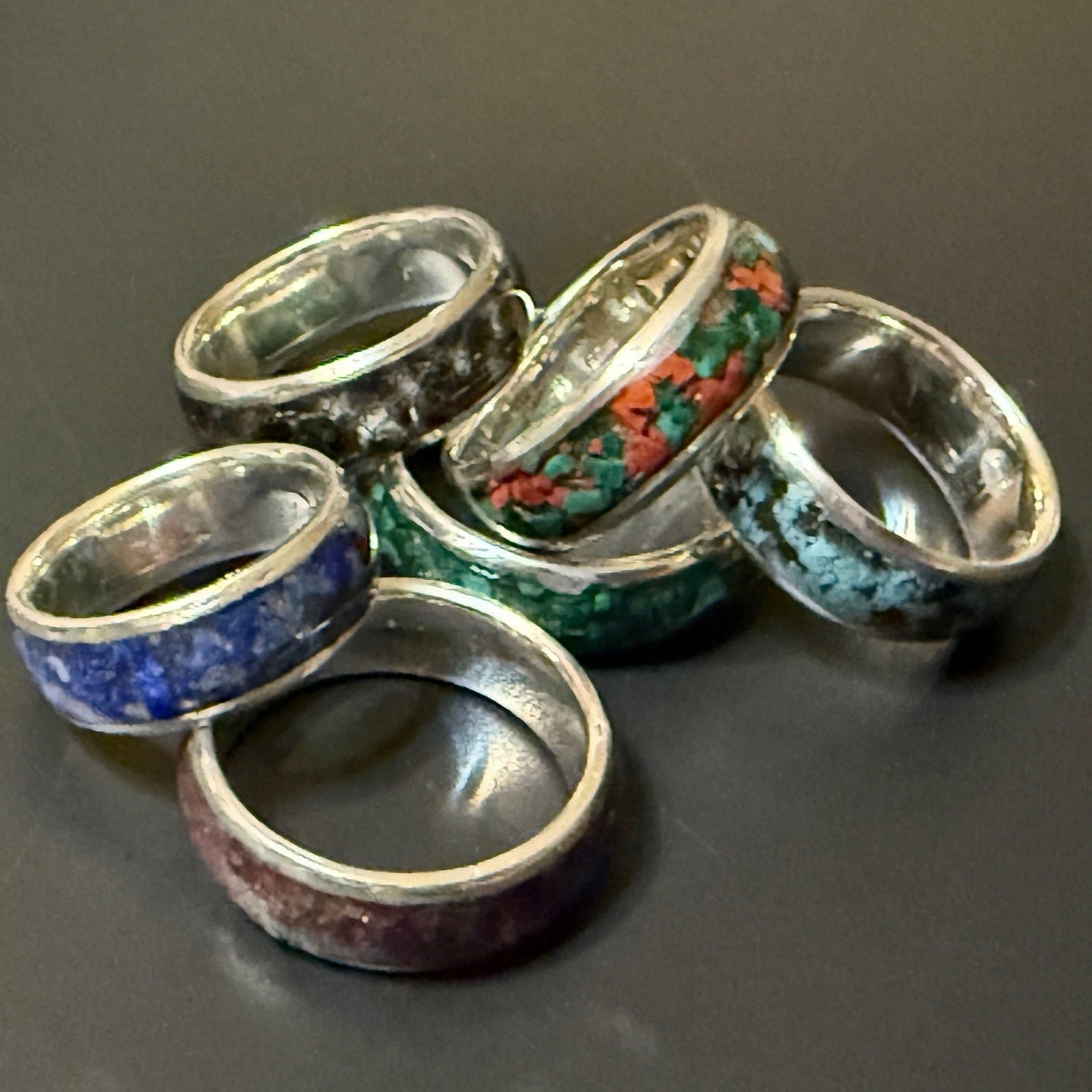 Collection of silver rings with one or two natural stones embedded in band