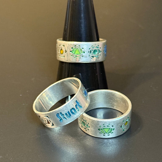 Three silver rings with Chakra engravings and personalized text