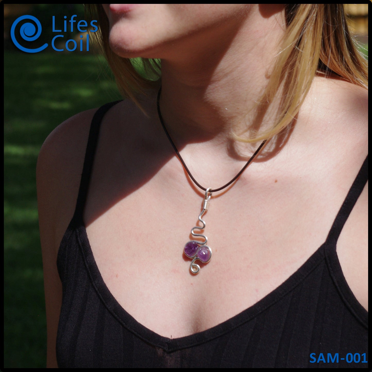 Handmade silver wire pendant with two natural amethyst