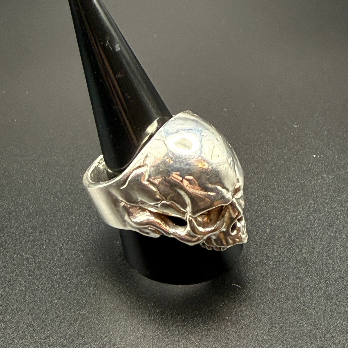 A silver skull ring.