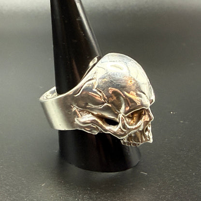 A silver skull ring  - side view