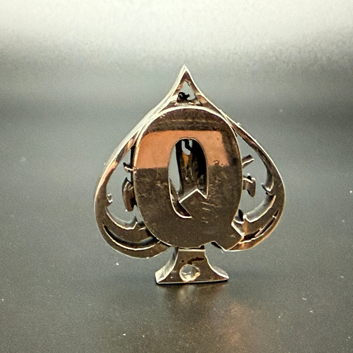 Favorite card made from more than an ounce of solid sterling silver. Added hole in base so it can be worn on as a pendant