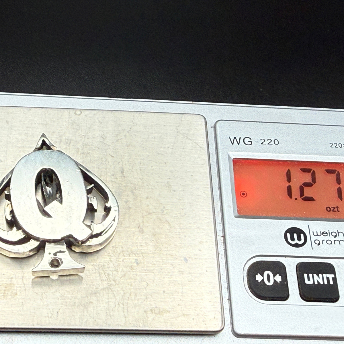 Favorite card protector on scale showing weight of 1.27 troy ounces of pure sterling silver