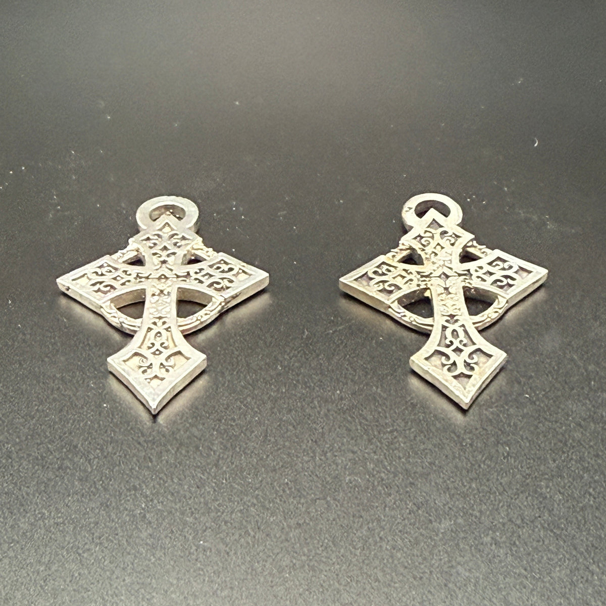 Two Celtic style sterling silver filigree cross with hanging loops.