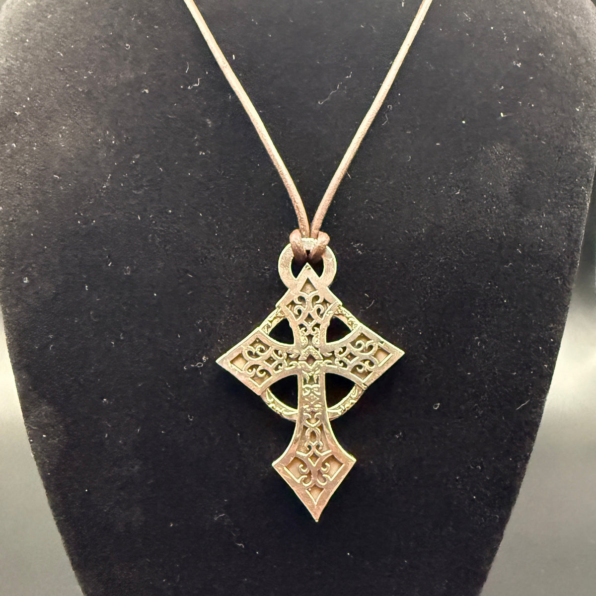 Celtic style sterling silver filigree cross with hanging loop.