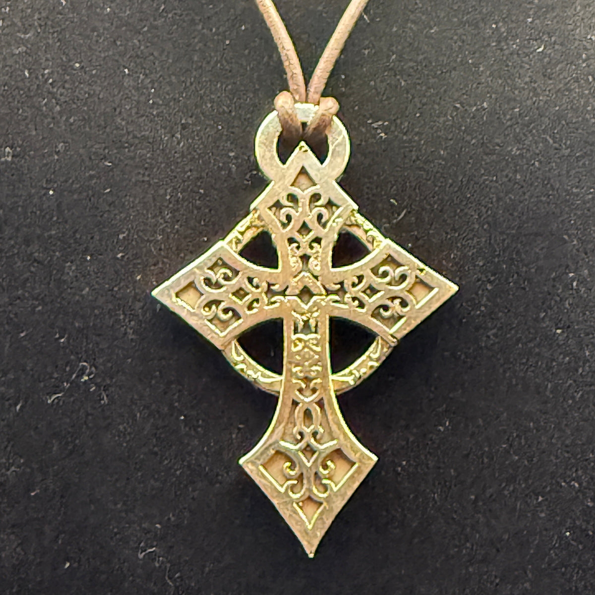 Celtic style sterling silver filigree cross with hanging loop.
