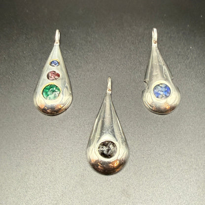 Three sterling silver teardrop pendants with   inlaid natural stones