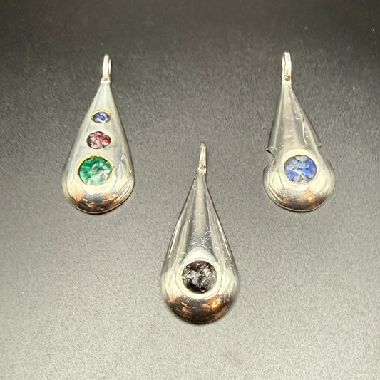 Three sterling silver teardrop pendants with   inlaid natural stones