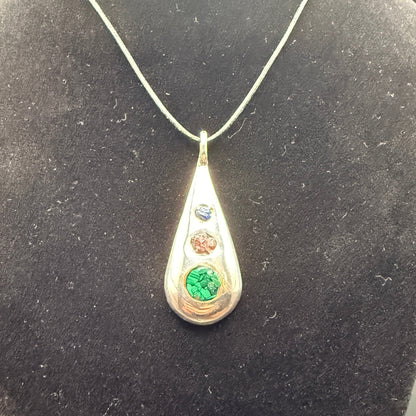 Handmade silver pendant with three natural stone chips and flat edge