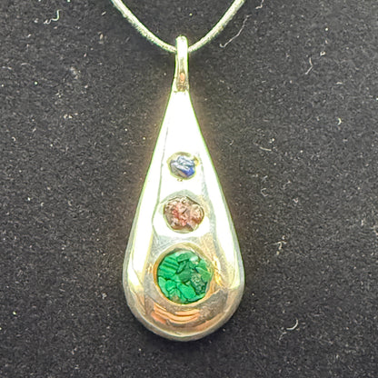Handmade silver pendant with three natural stone chips and flat edge