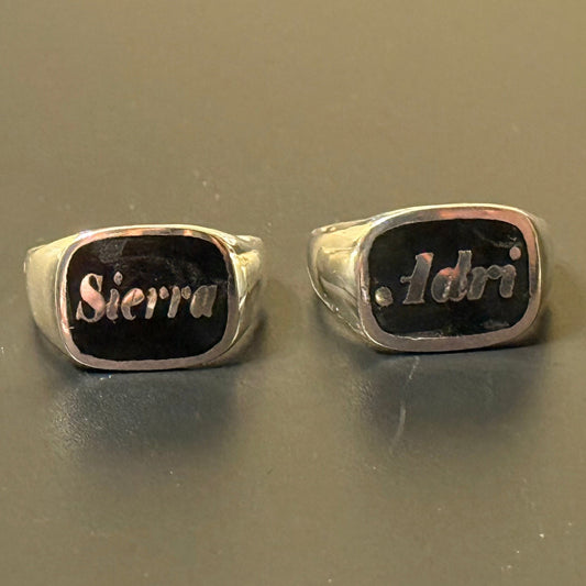 Custom handmade silver signet rings with black background