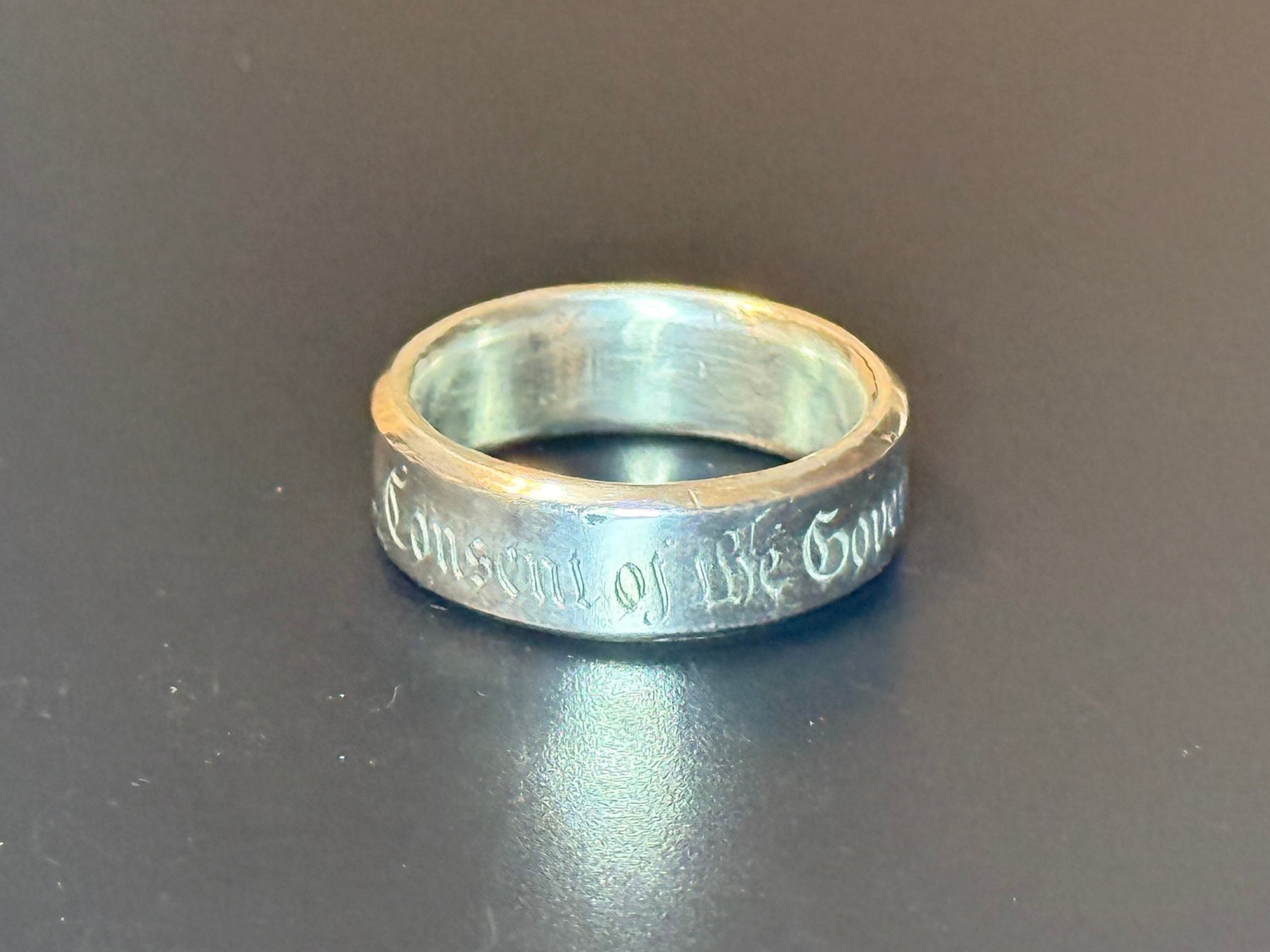 Consent of the Governed engraved silver band
