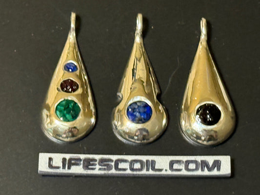 Collection of handmade silver pendants with one, two or three natural stone chips.