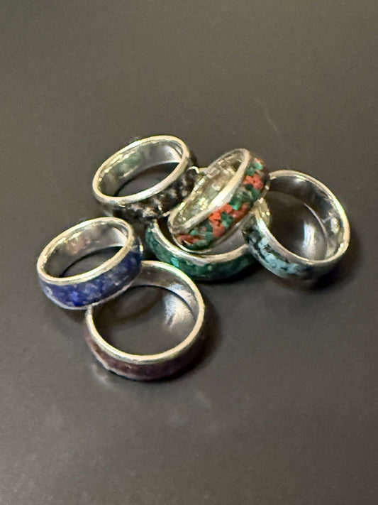 Collection of handmade silver rings with one or two natural stones embedded in band