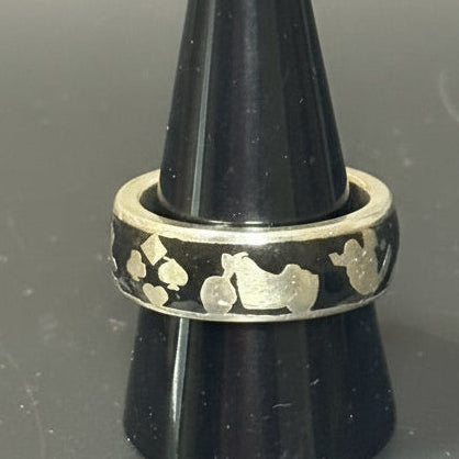 Silver embedded icon ring with symbols representing activities and interests