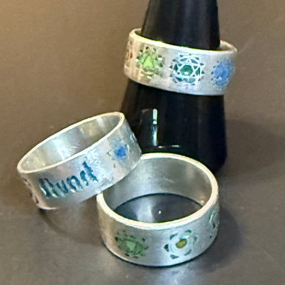 Three silver rings with Chakra engravings and personalized text
