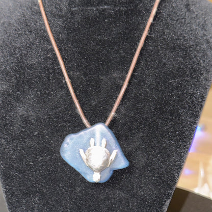 Large light blue sea glass pendant with a silver sea turtle.