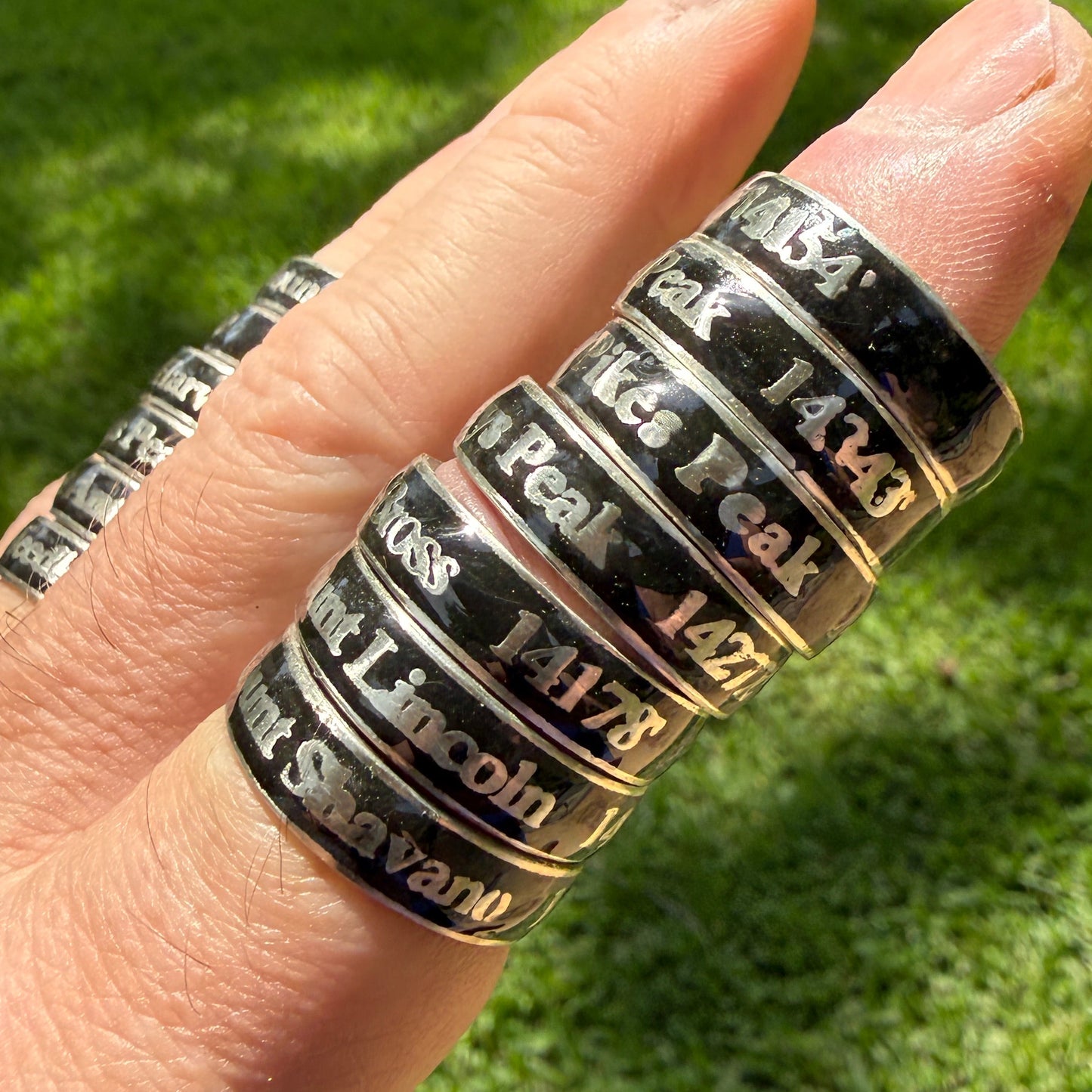 Multiple embedded rings with names and elevations of summitted Colorado 14ers