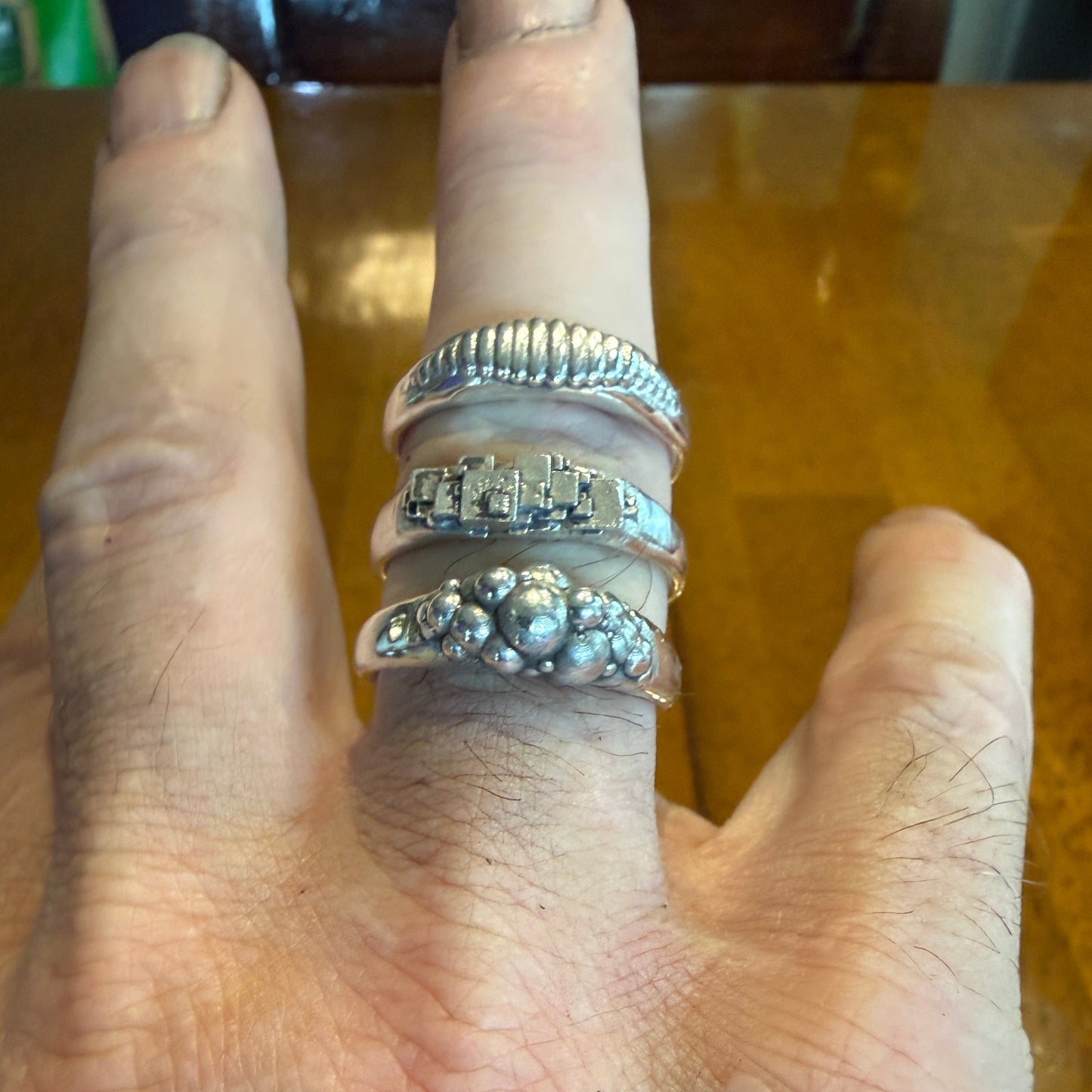 Ellipse, cube and sphere shapes clustered on narrow signet rings
