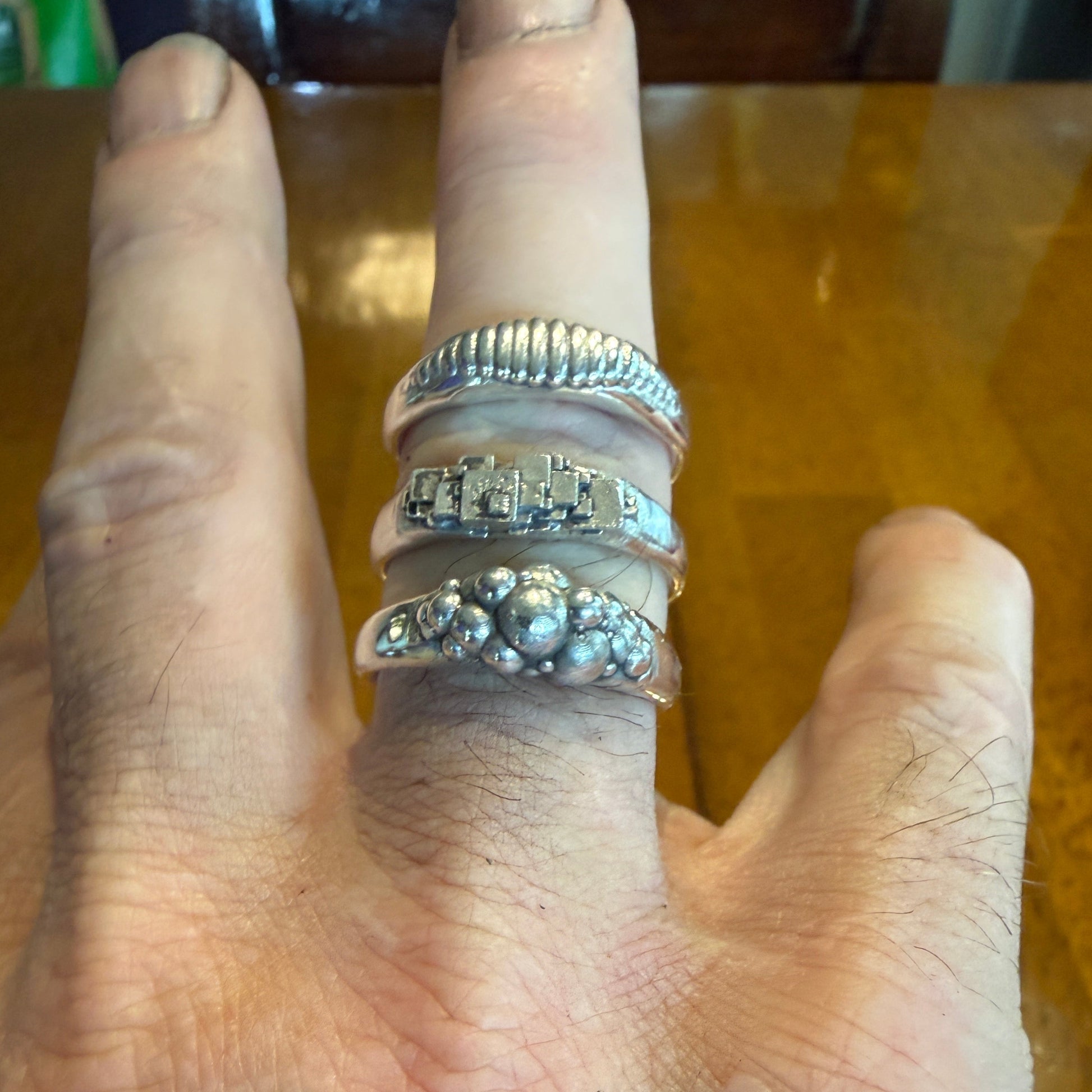 Ellipse, cube and sphere shapes clustered on narrow signet rings