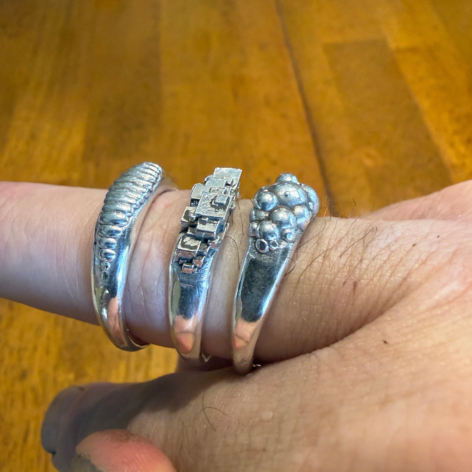 Ellipse, cube and sphere shapes clustered on narrow signet rings