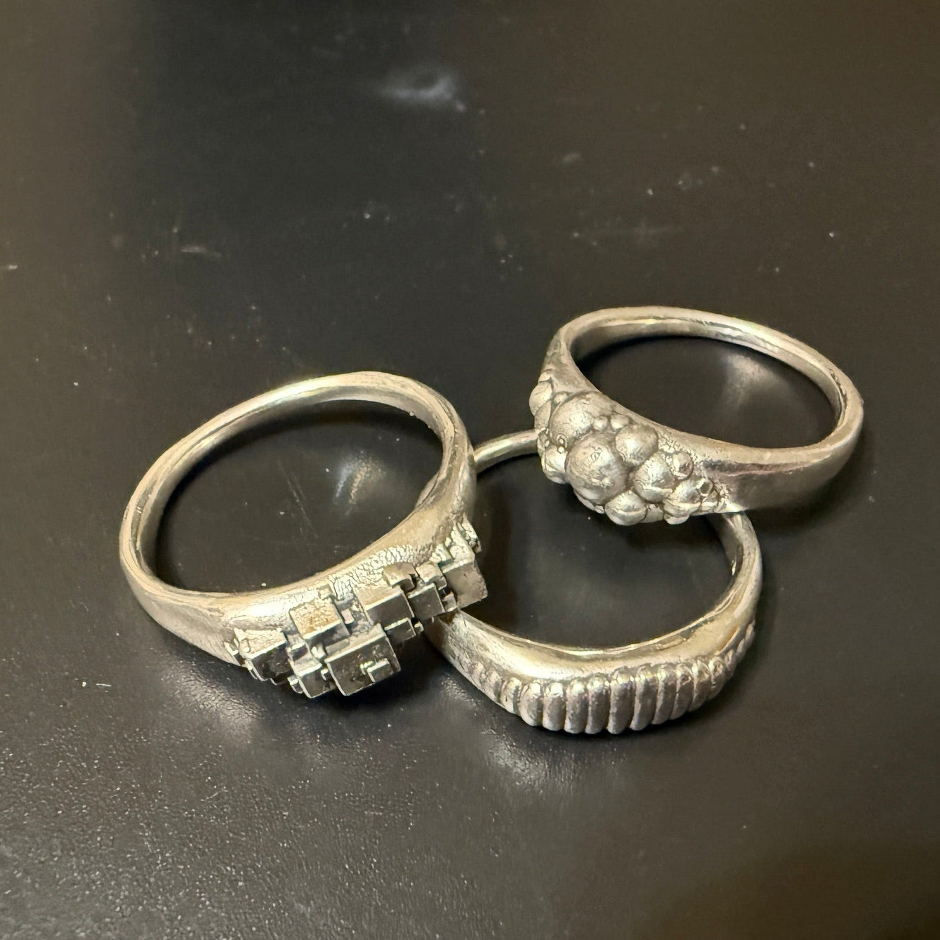 Ellipse, cube and sphere shapes clustered on narrow signet rings