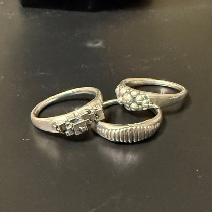 Ellipse, cube and sphere shapes clustered on narrow signet rings