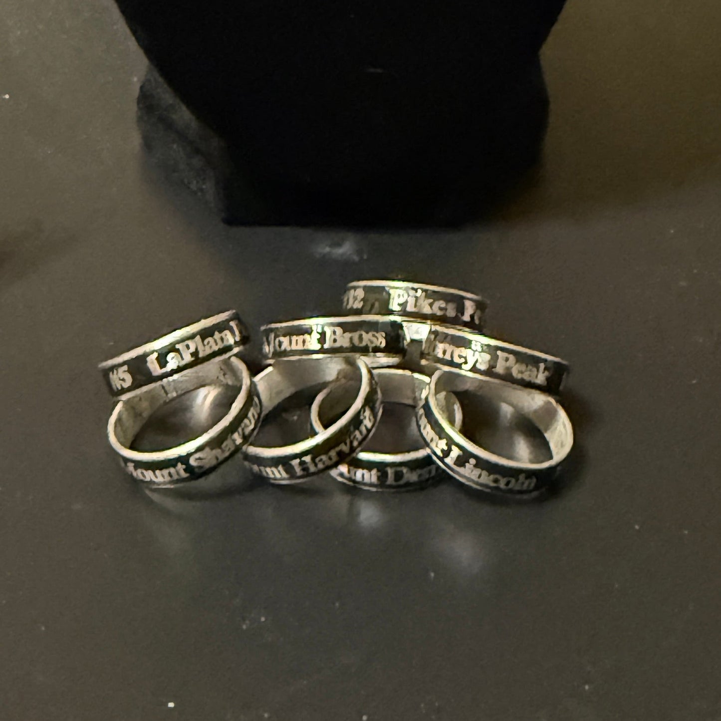 Eight 14er summit rings.