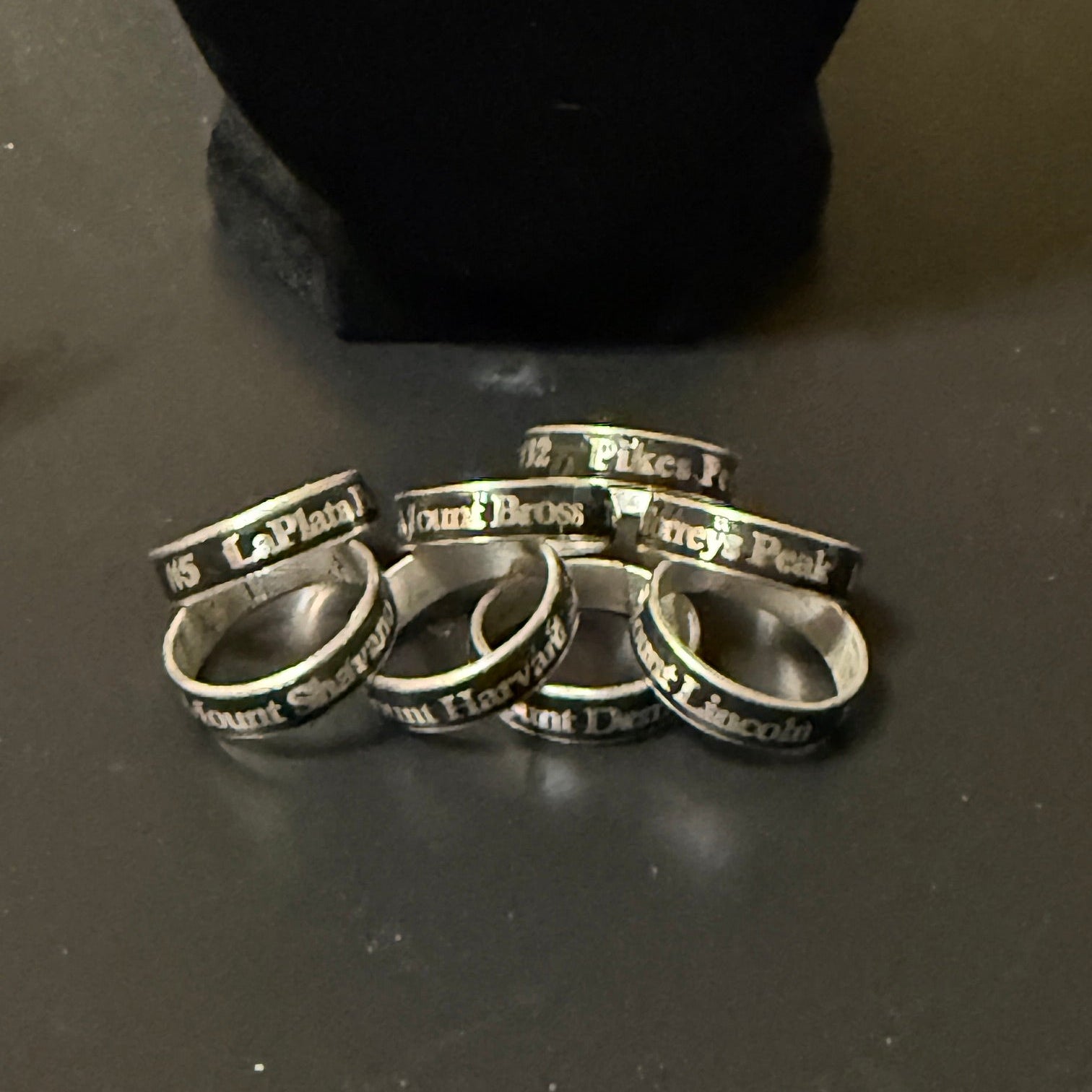 Eight 14er summit rings.