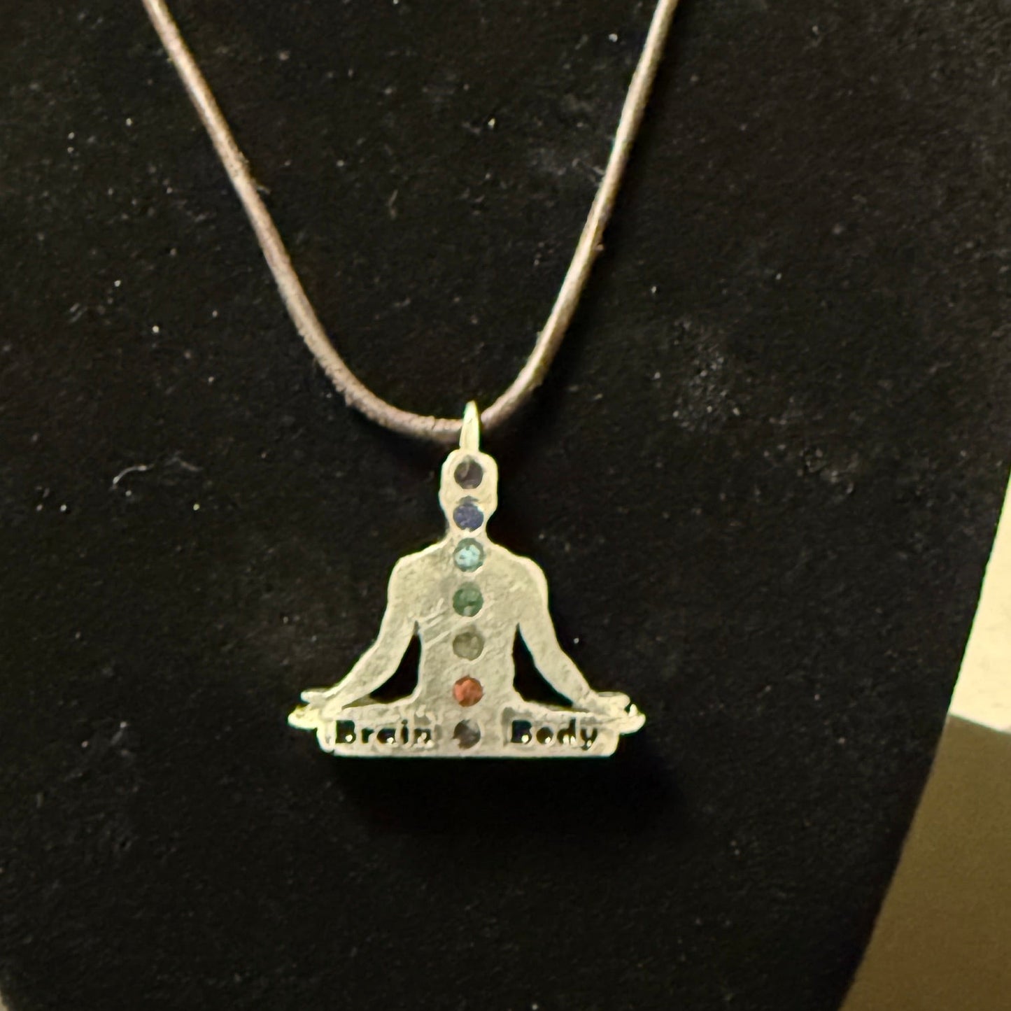 Chakra pendant with natural stone colors and custom engraving